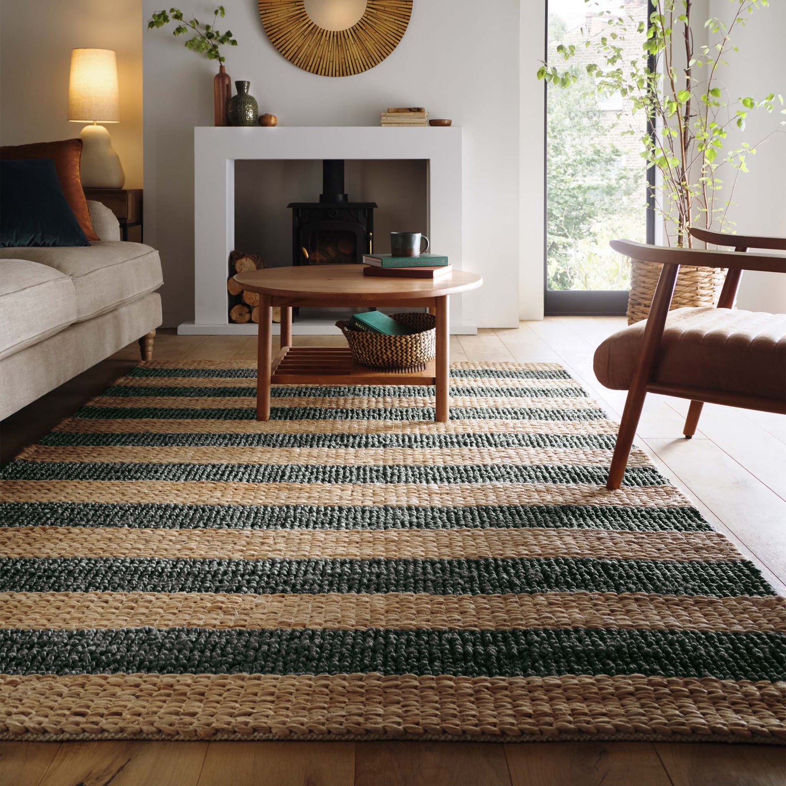 Bondi Jute Stripe Natural/Bottle Green Rug with a green stripe design, styled in a living room.