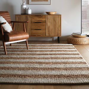 Bondi Jute Stripe Cream\Natural Rug with a stripe design, styled on wooden flooring.