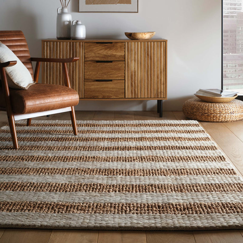 Bondi Jute Stripe Cream\Natural Rug with a stripe design, styled on wooden flooring.