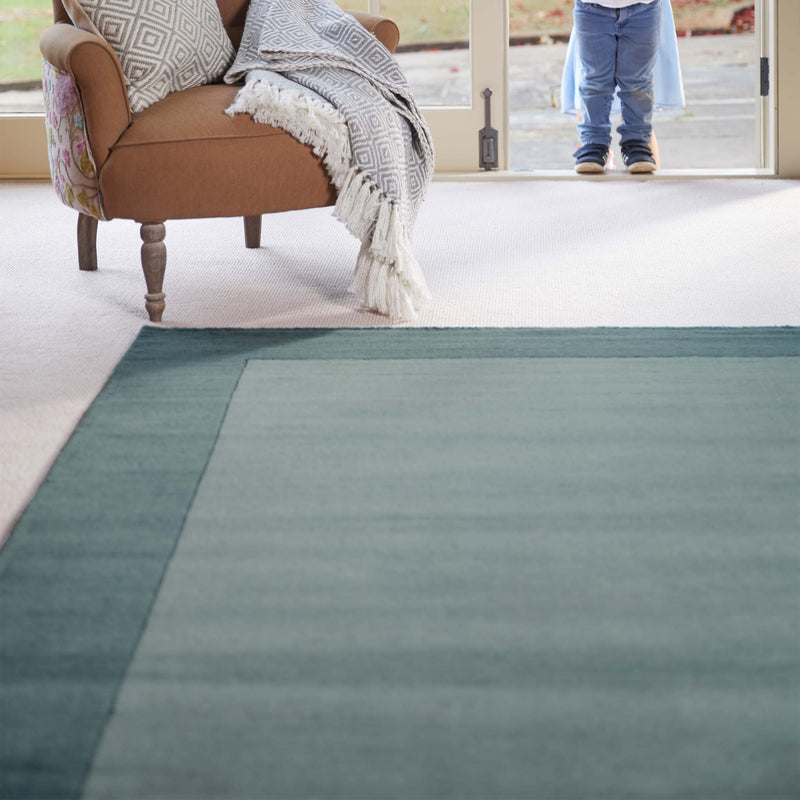 Borders Duck Egg Blue 100% wool rug with a two-tone border design.