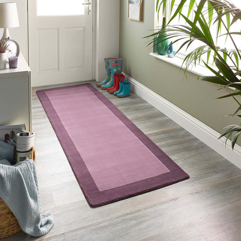 Borders Mauve Purple Pink 100% wool runner with a two-tone border design, styled in a entryway.