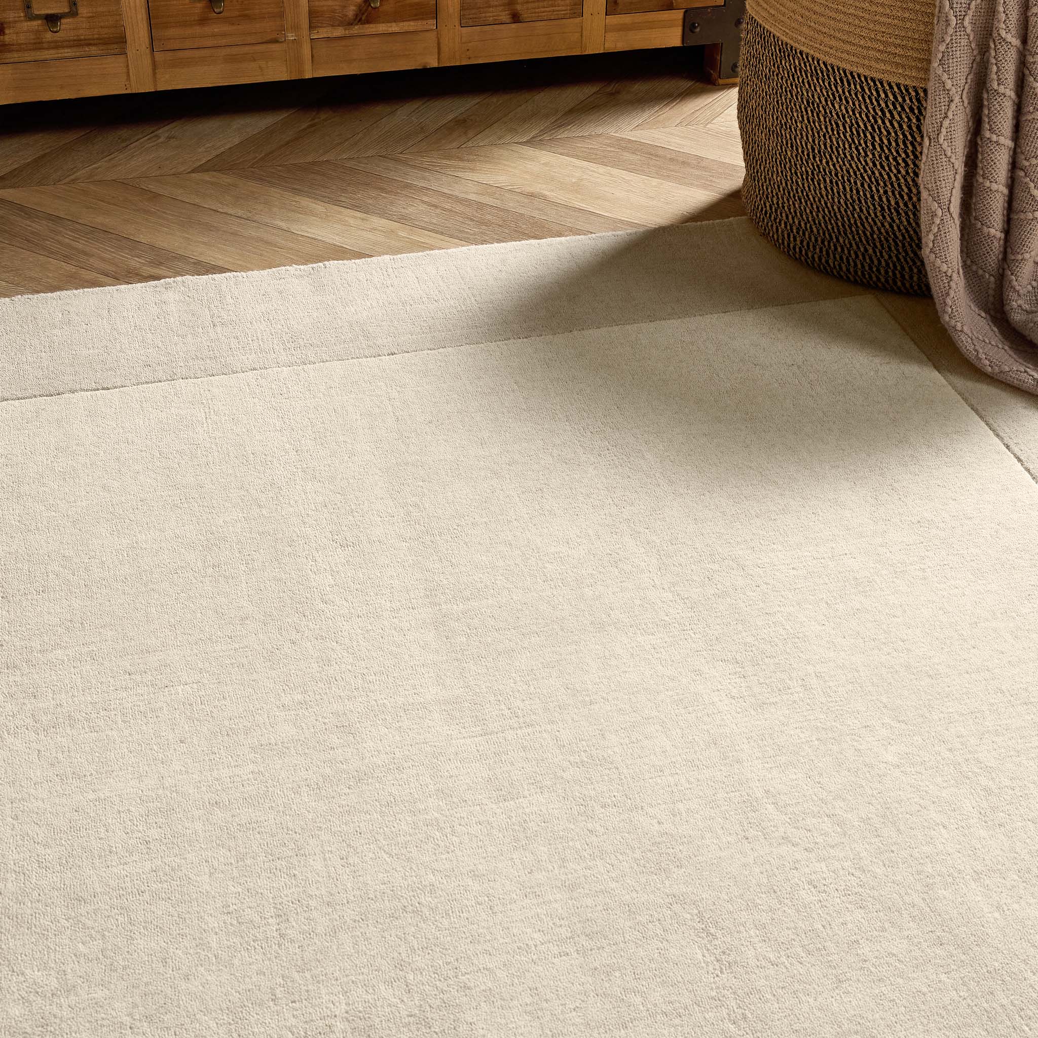 Border Nautral Rug - a 100% wool rug featuring a darker natural border. 