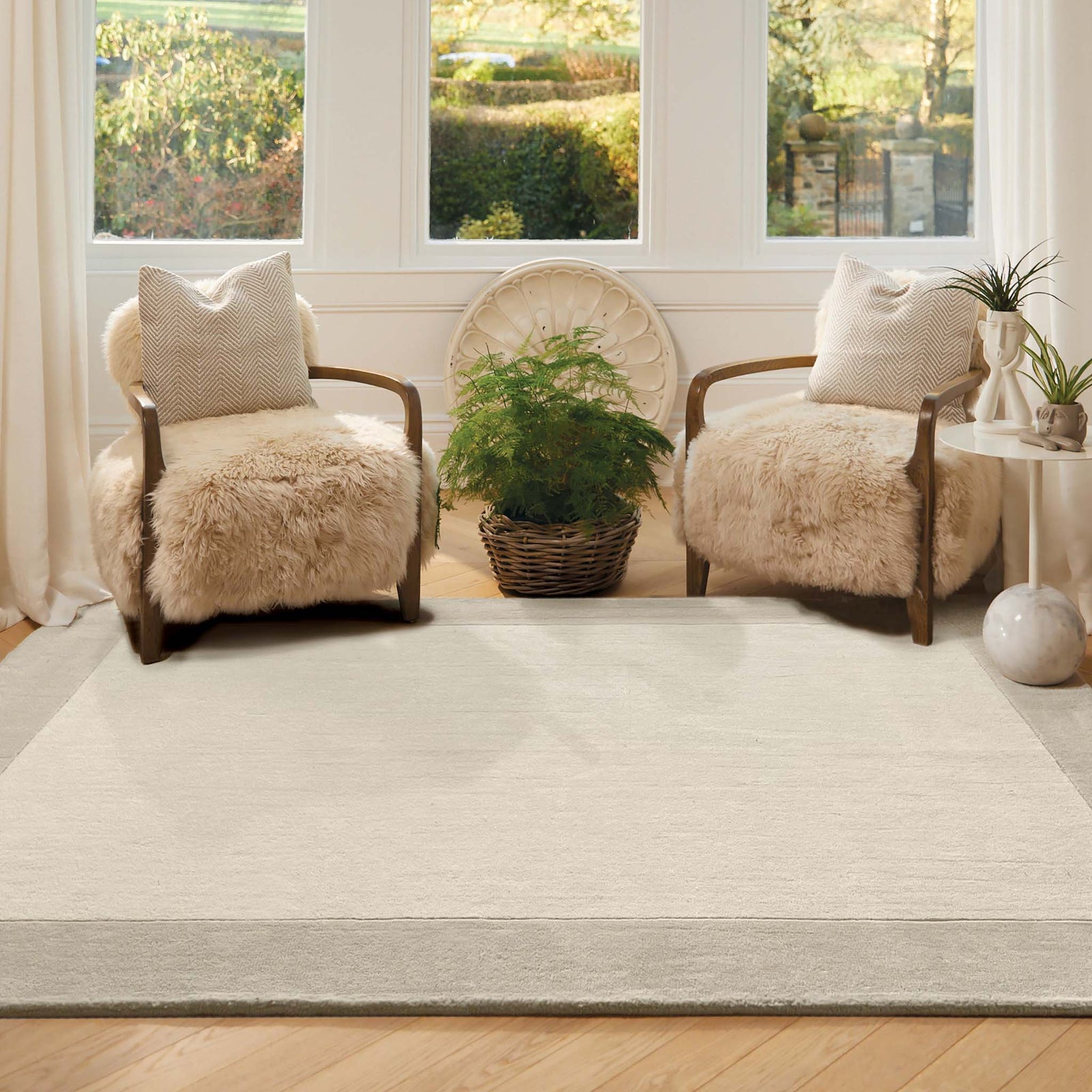Border Nautral Rug - a 100% wool rug featuring a darker natural border. 