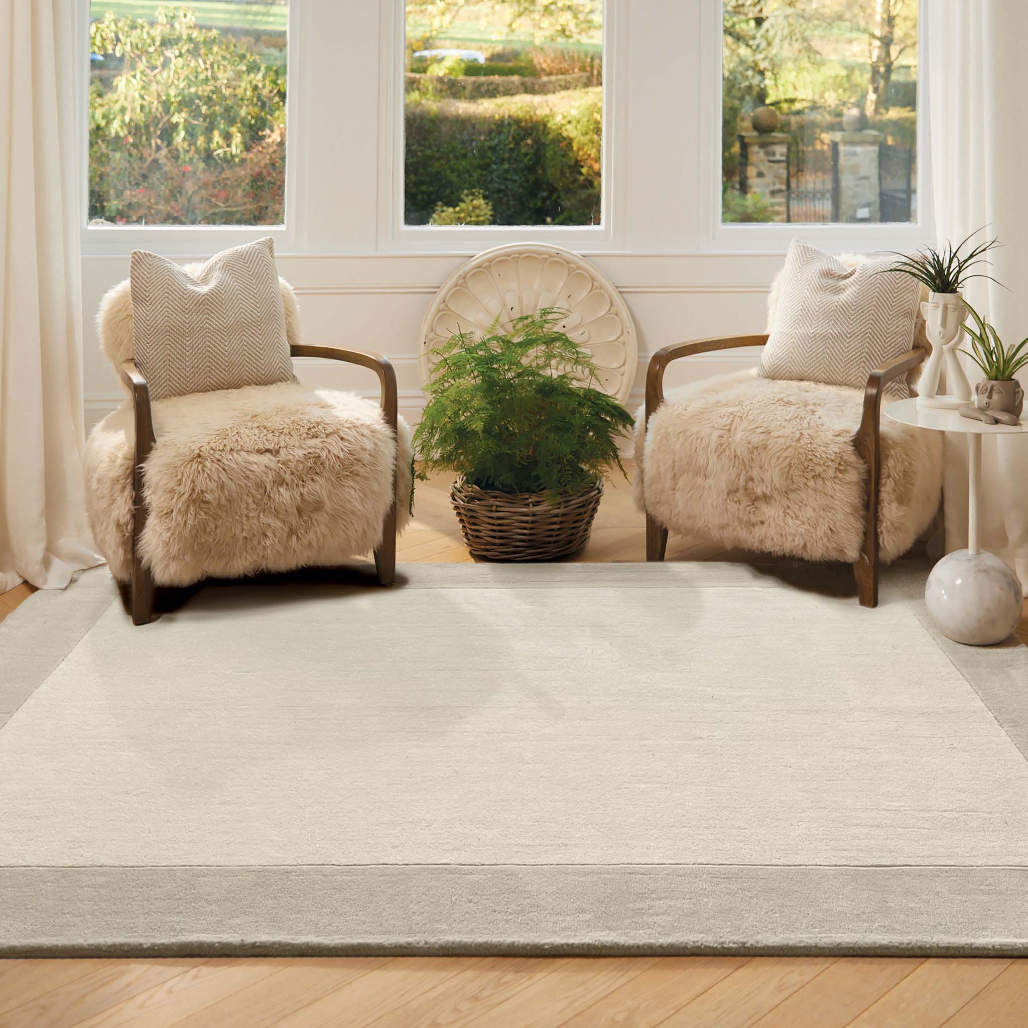 Border Nautral Rug - a 100% wool rug featuring a darker natural border. 