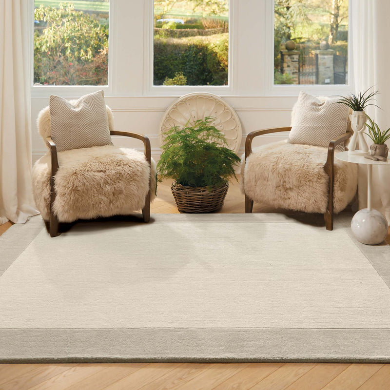Border Nautral Rug - a 100% wool rug featuring a darker natural border. 