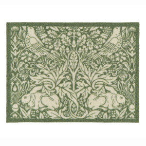 A rectangular outdoor doormat featuring a classic William Morris-style botanical and animal pattern with green and cream rabbits, birds, and foliage, shown flat against a white background