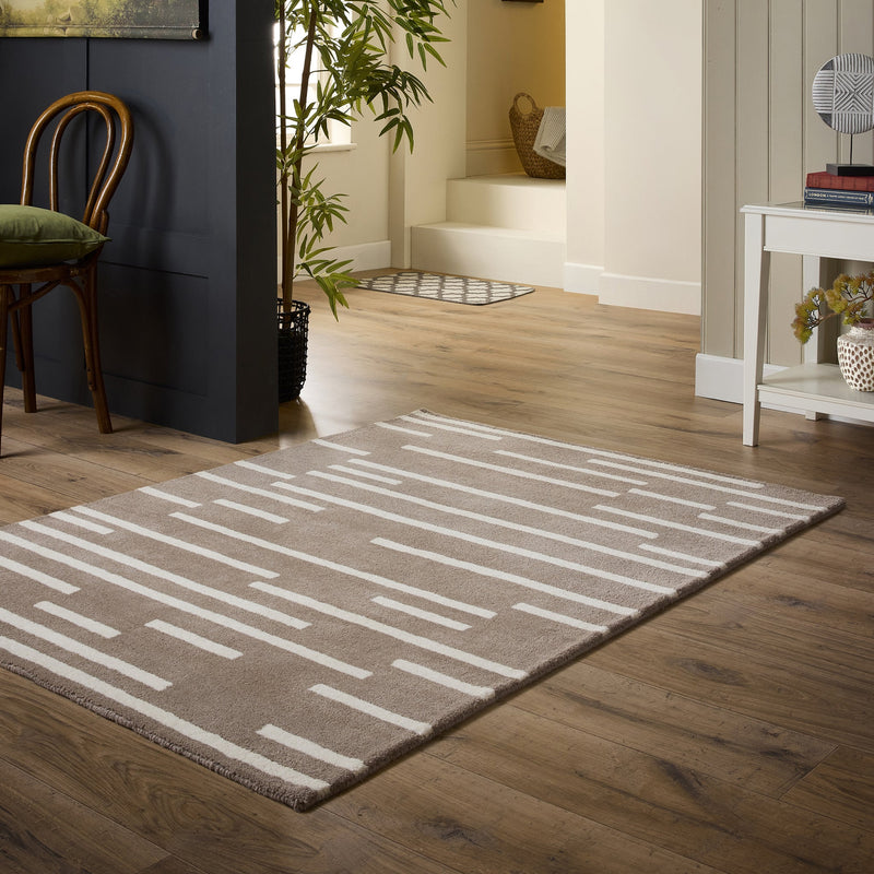 Broken Stripe- hand-tufted wool cut pile rug in Brown and White with a broken striped design.