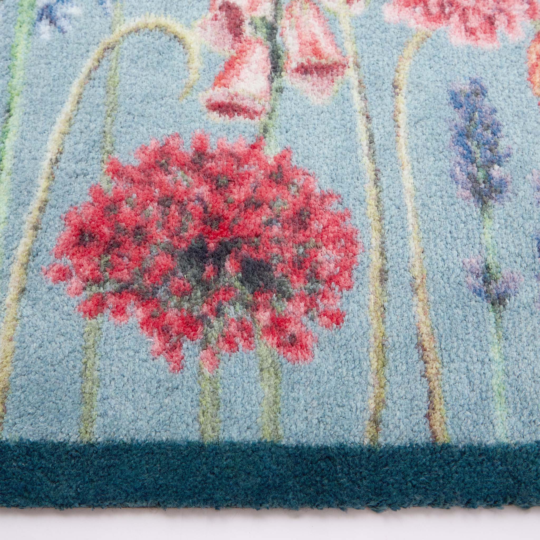 Butterfly Garden Blue Doomat- 100% recycled cotton doormat featuring a wildflower garden and butterflies.