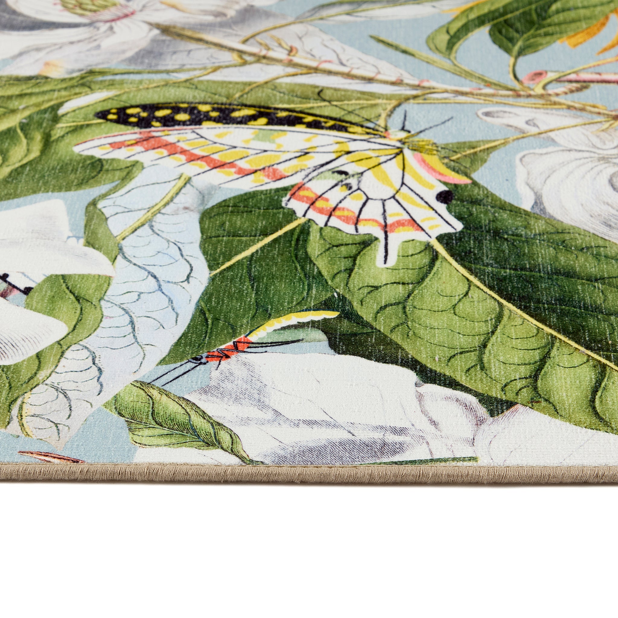 Butterfly Blooms Eco Washable Rug made from 100% recycled materials, featuring butterflies and oversized blooms.