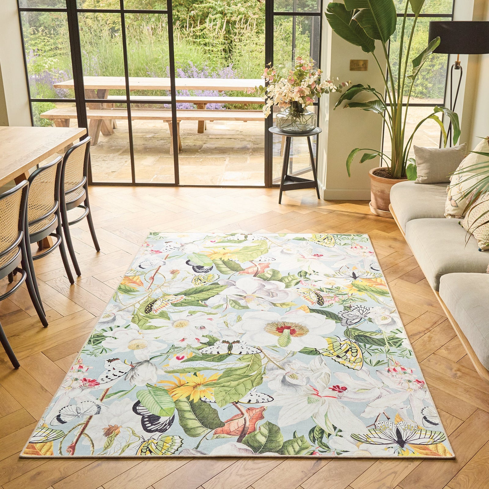 Butterfly Blooms Eco Washable Rug made from 100% recycled materials, featuring butterflies and oversized blooms.