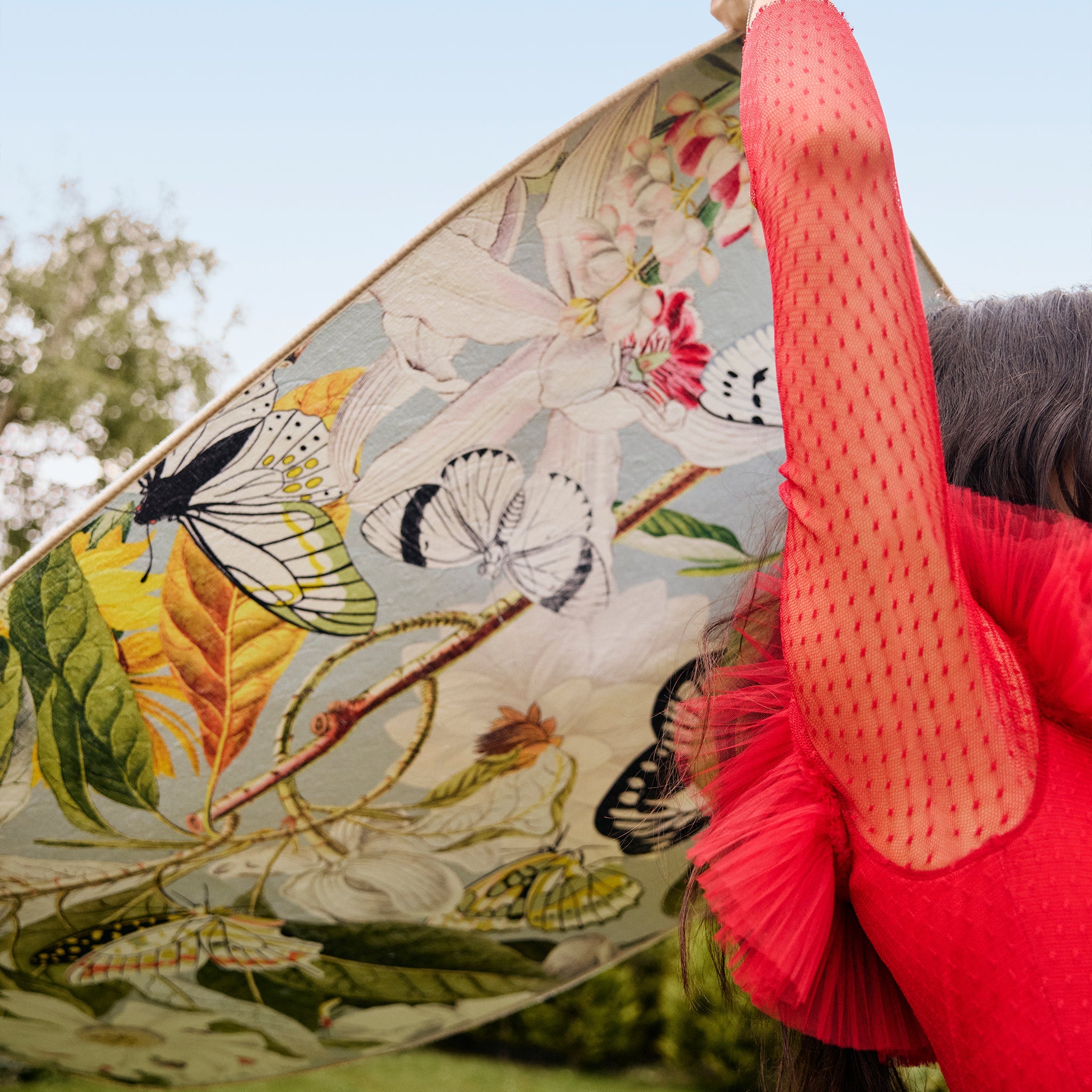 Butterfly Blooms Eco Washable Rug made from 100% recycled materials, featuring butterflies and oversized blooms.
