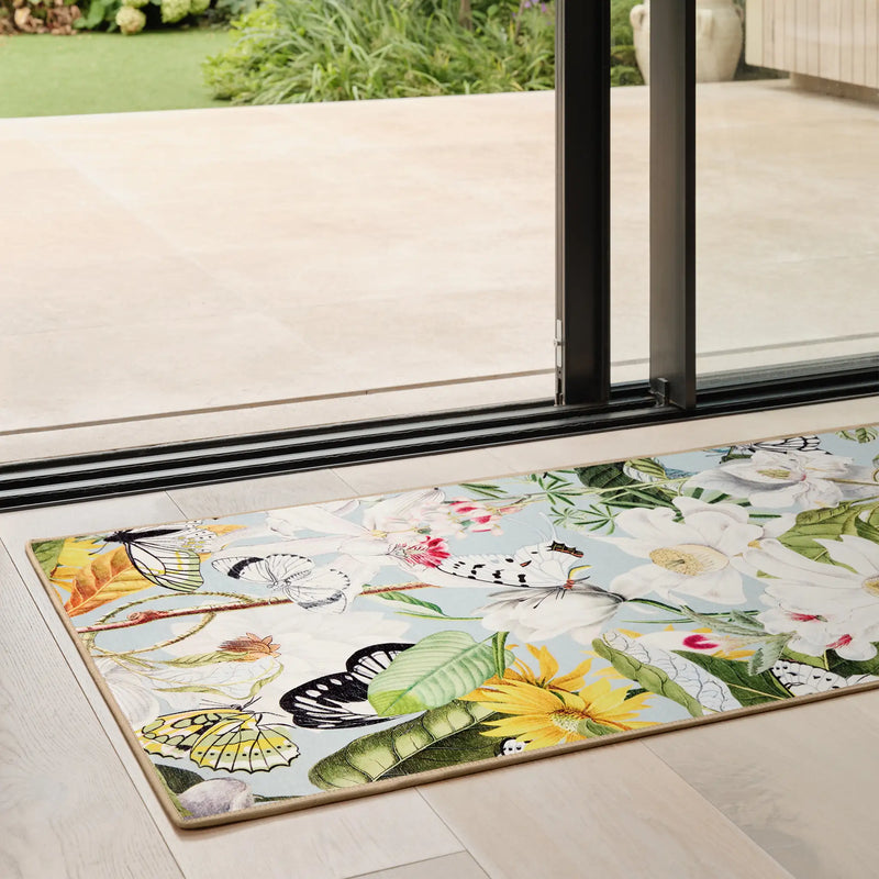 Butterfly Blooms Blue Eco-Washable Runner with a floral butterly design, styled in a doorway.