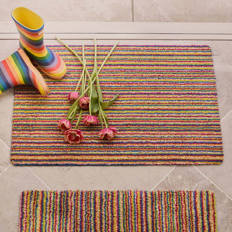 Candy Bright Doormat - a 100% recycled material doormat featuring a colourful  striped pattern. 