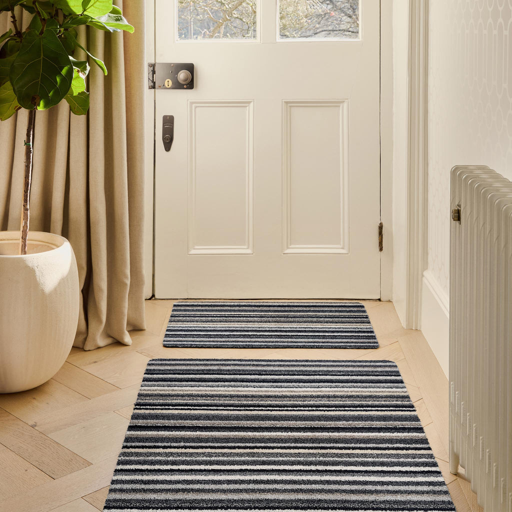 Candy Monochrome doormat- a cotton doormat featuring a striped design  in beige, grey, brown, black, and white.