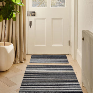 Candy Monochrome doormat- a cotton doormat featuring a striped design  in beige, grey, brown, black, and white.
