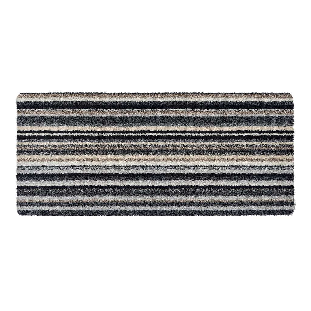 Candy Monochrome Washable Runner- a 100% recycled material runner featuring a subtle striped pattern in beige, grey, brown, black, and white. 
