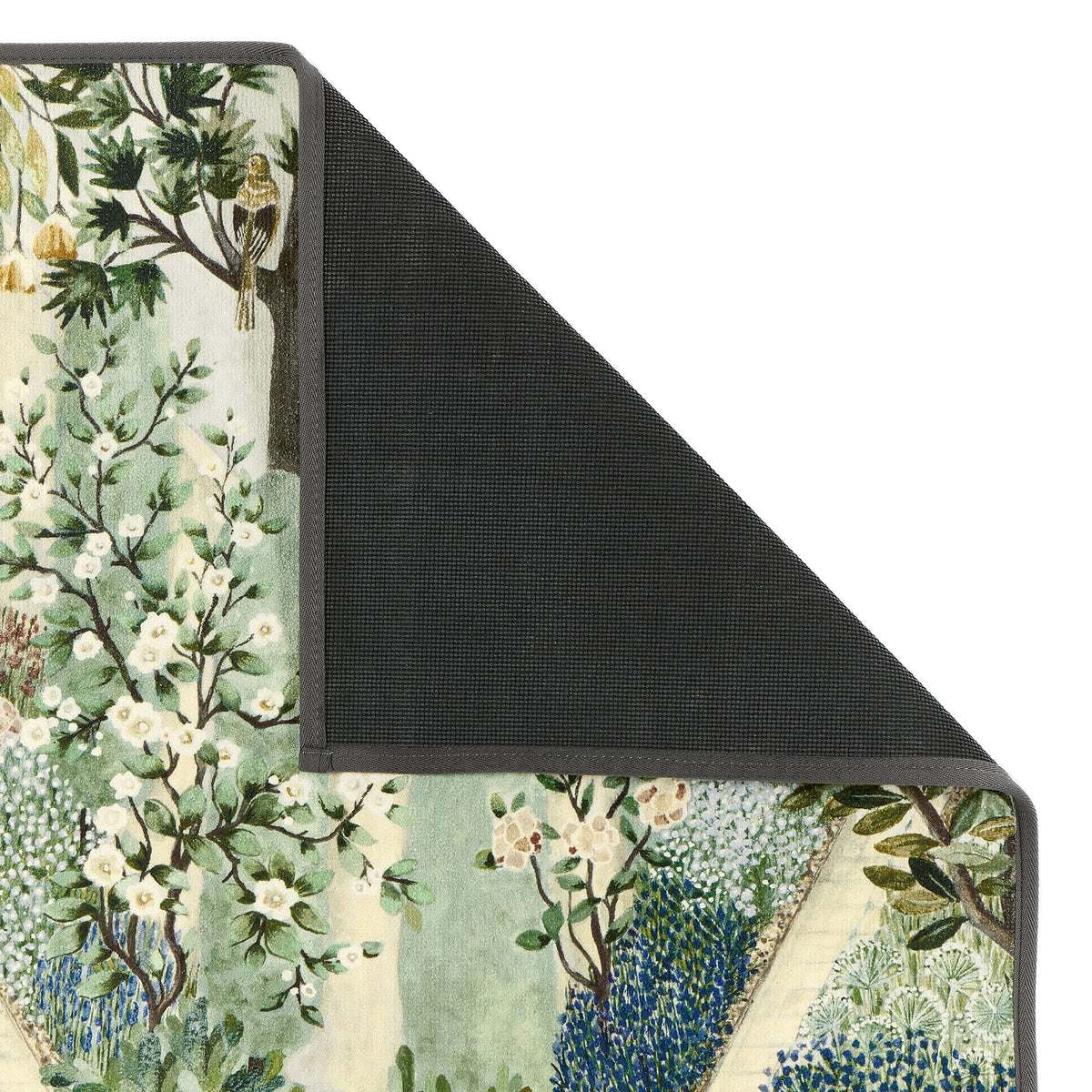 Carpet Garden Sanctuary Eco-Washable Rug with a garden inspired pattern showing the rubber backing. 