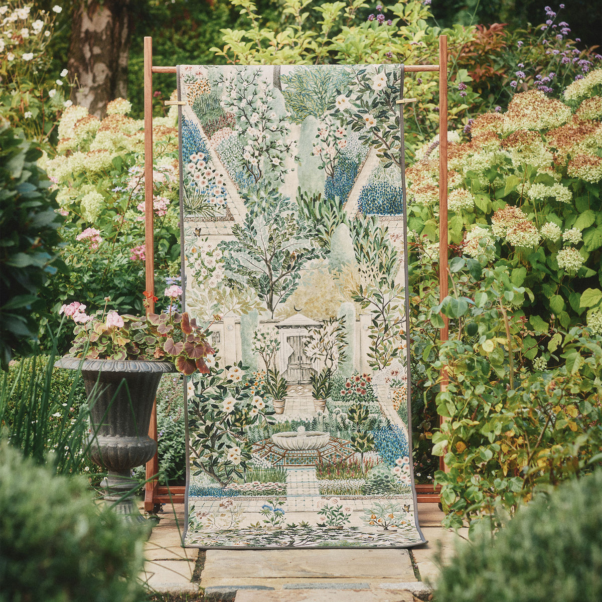 Carpet Garden Sanctuary Eco-Washable Runner with a garden inspired pattern, styled in a garden.