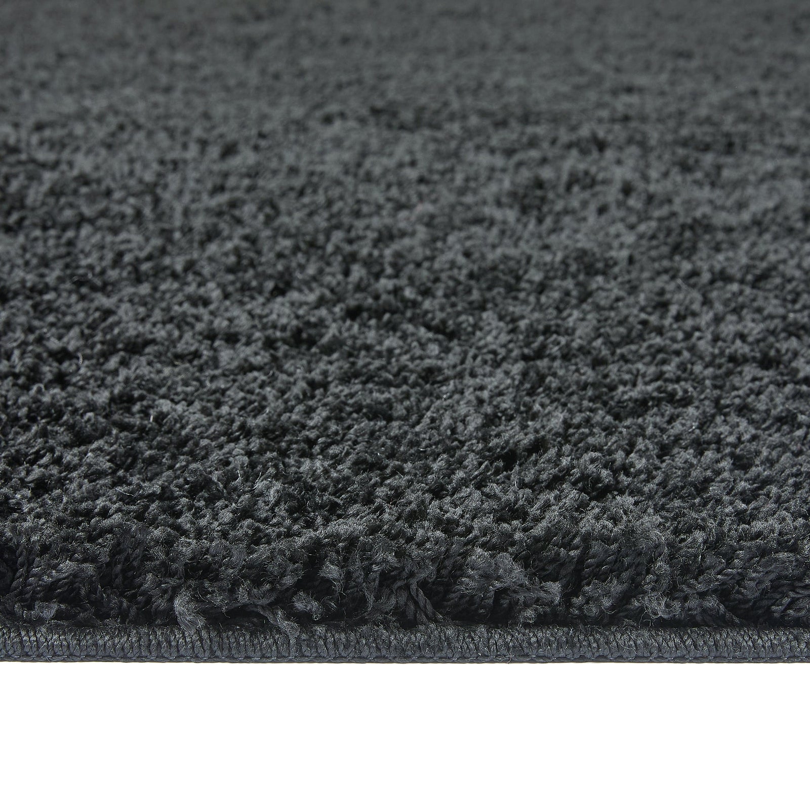 Charcoal Washable Rug in a solid dark grey colour, fully machine washable.