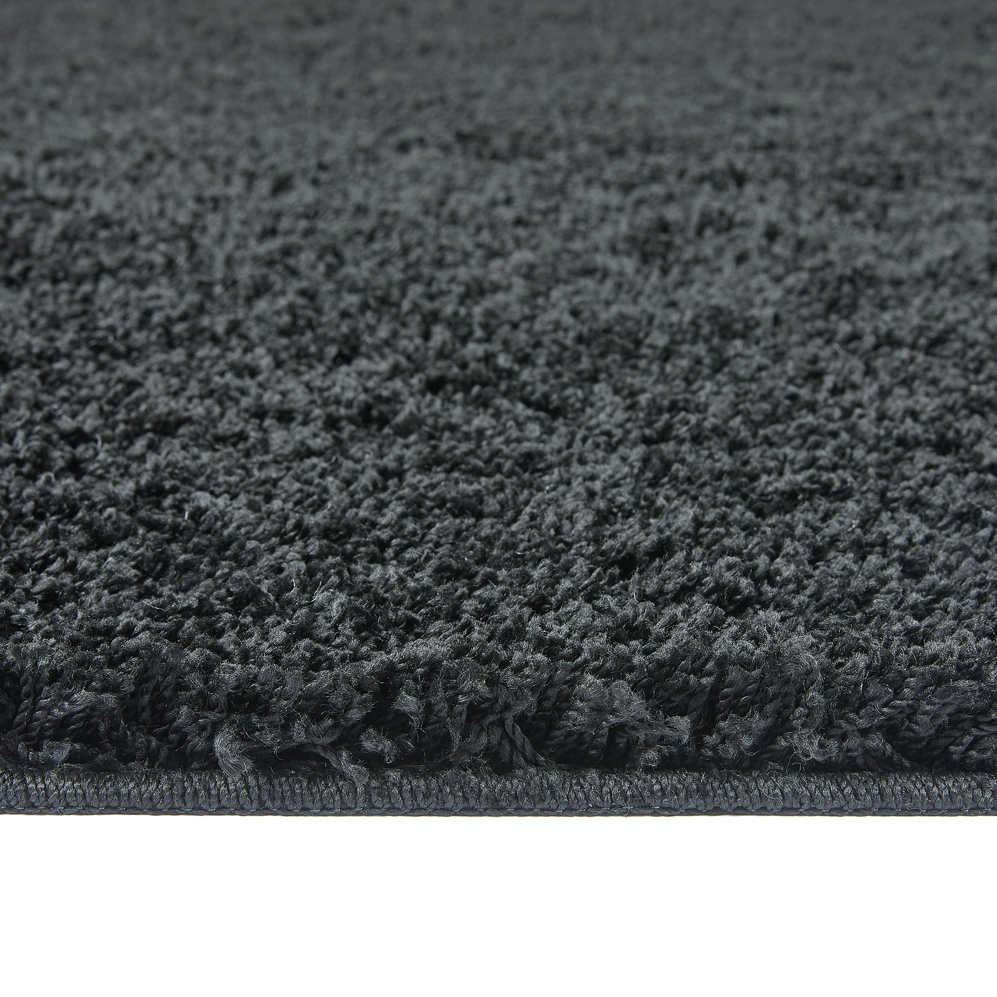 Charcoal Washable Rug in a solid dark grey colour, fully machine washable.