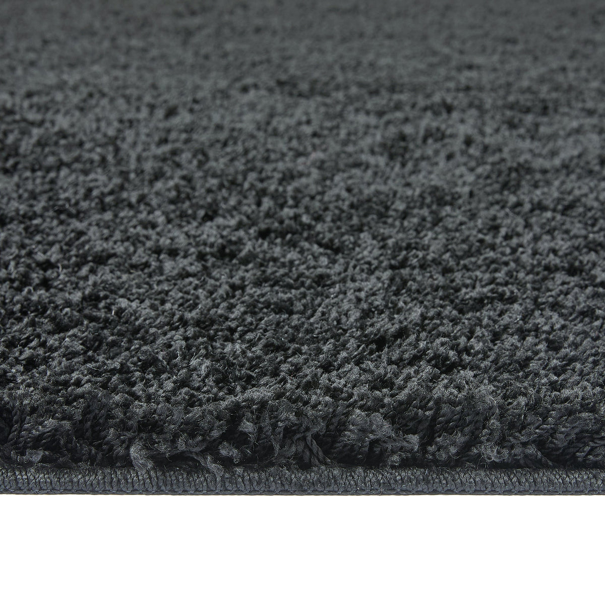 Charcoal Washable Rug in a solid dark grey colour, fully machine washable.
