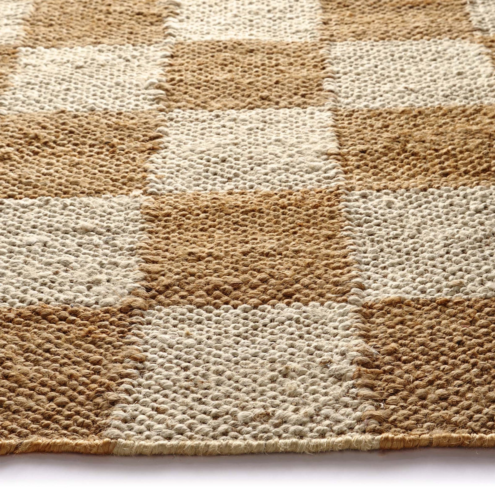Close-up of Checkerboard Jute Natural Rug with natural and brown checkerboard pattern.