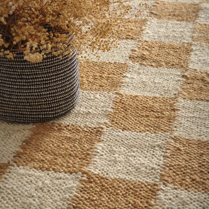 Close-up of Checkerboard Jute Natural Runner with a natural and brown checkerboard pattern.