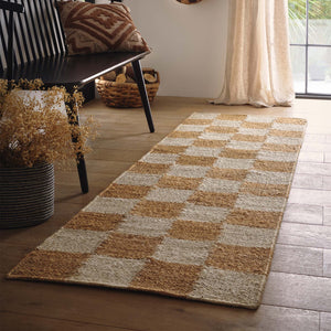 Checkerboard Jute Natural Runner with a natural and brown checkerboard pattern, styled on wooden flooring.