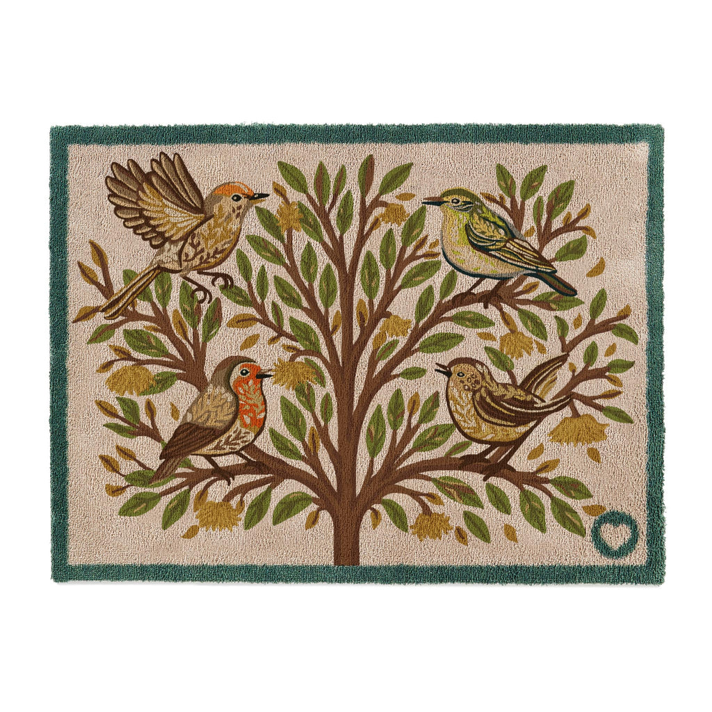Chorus Bird Washable Doormat- a cotton doormat featuring multicoloured birds perched on a tree surround by orange and green leaves.