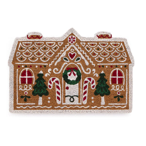 Discover the Christmas Gingerbread Cottage Coir Doormat- a coir doormat shaped as a gingerbread house decorated with sweets and icing. 
