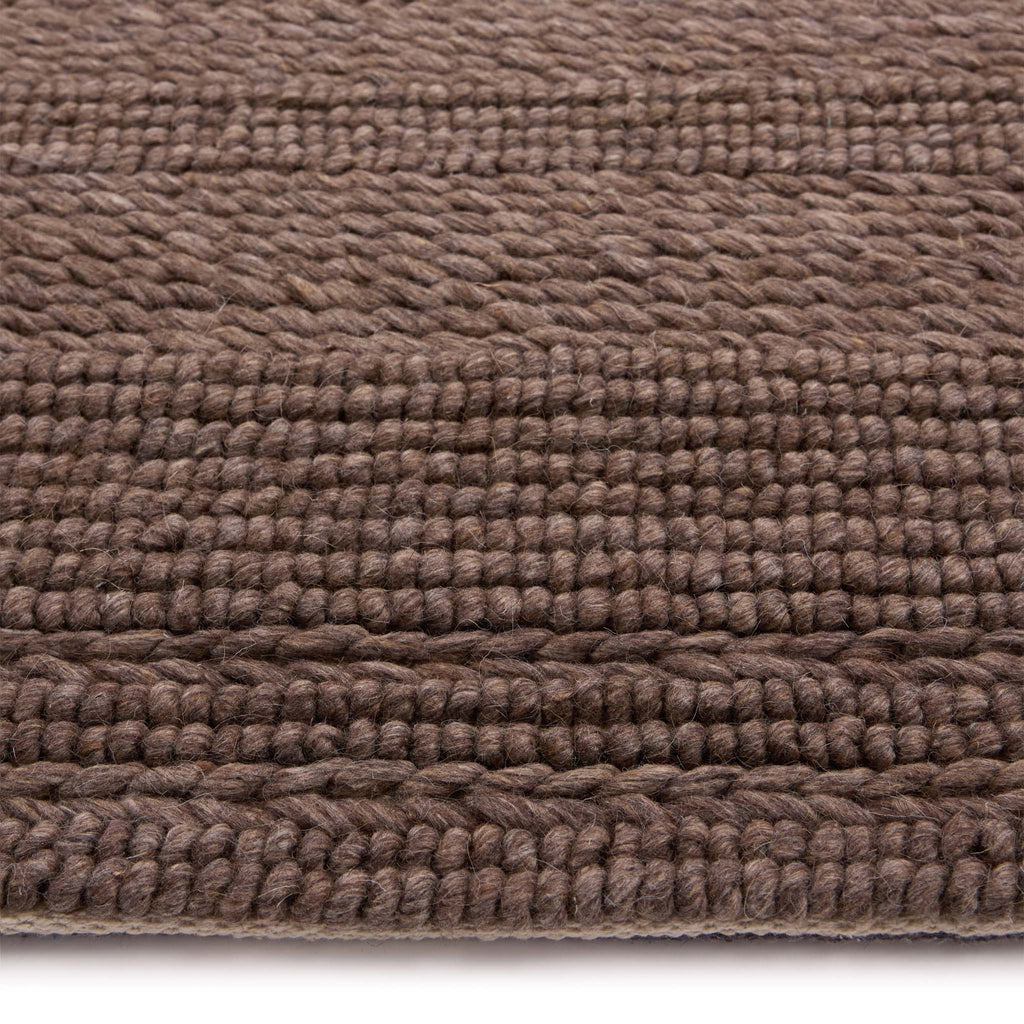 Chunky Knit Rug Brown- 100% wool rug featuring a knitted pattern in brown.