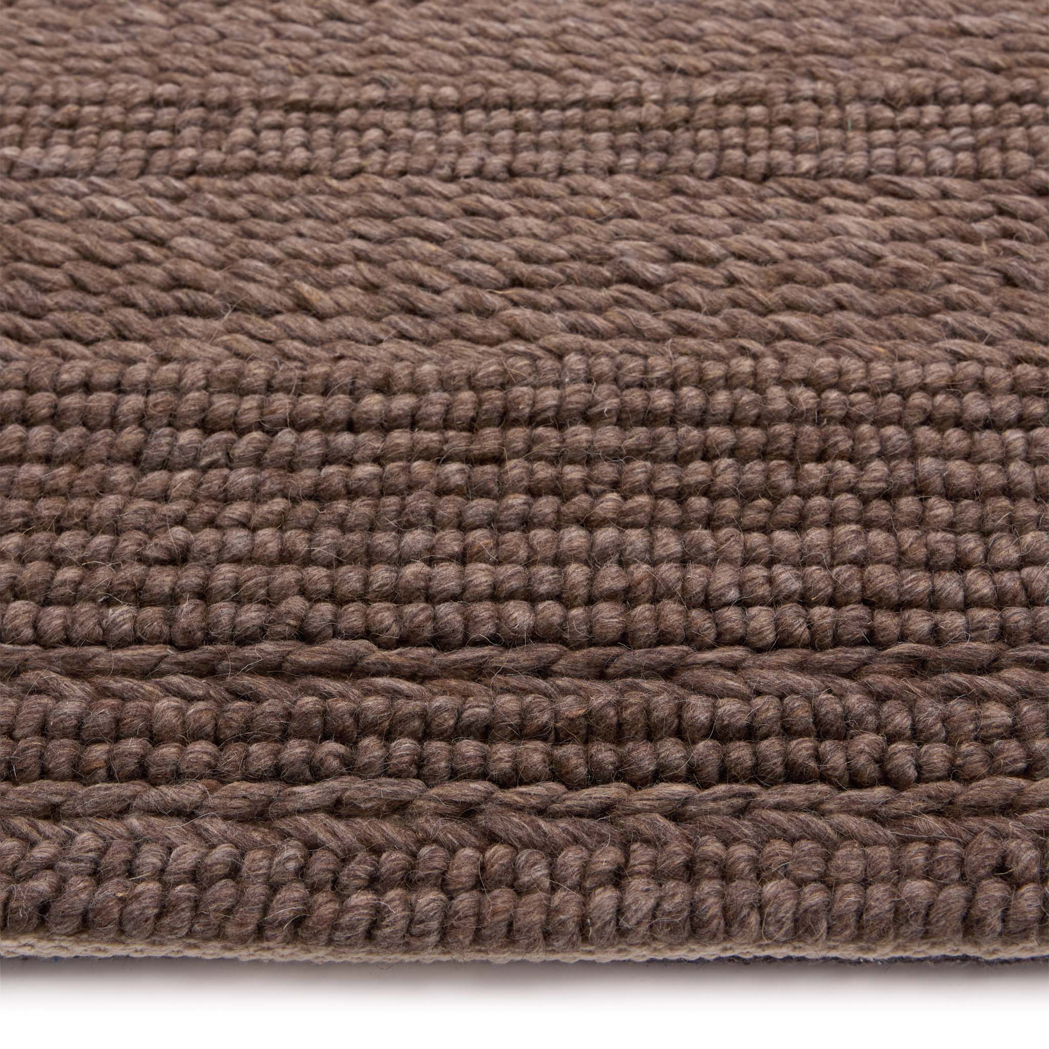 Chunky Knit Rug Brown- 100% wool rug featuring a knitted pattern in brown.