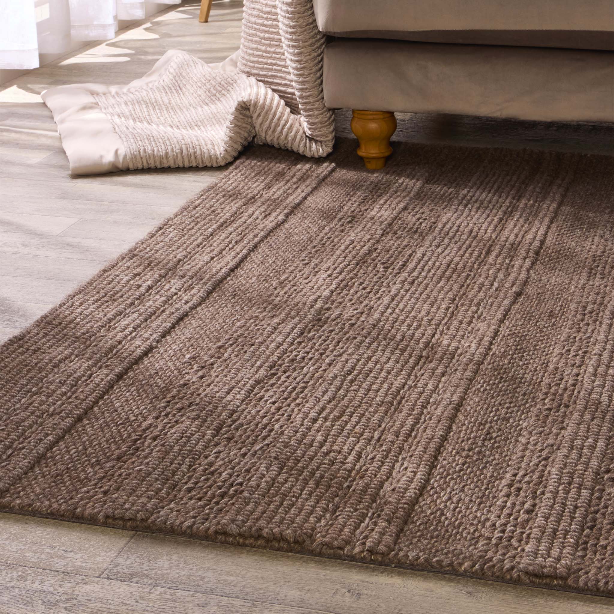 Chunky Knit Rug Brown- 100% wool rug featuring a knitted pattern in brown.