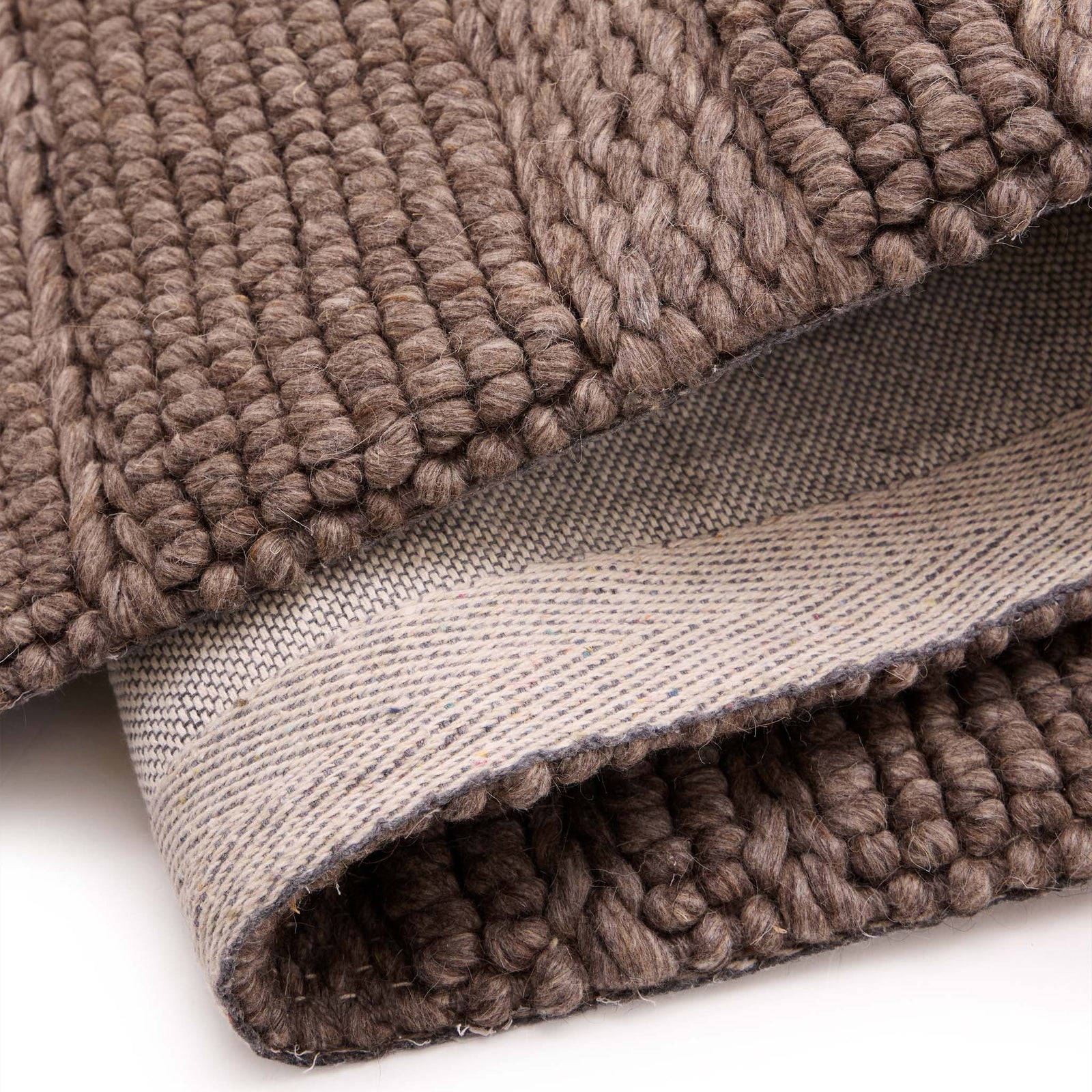 Chunky Knit Brown Runner. Made from 100% wiil featuring a textured pattern.