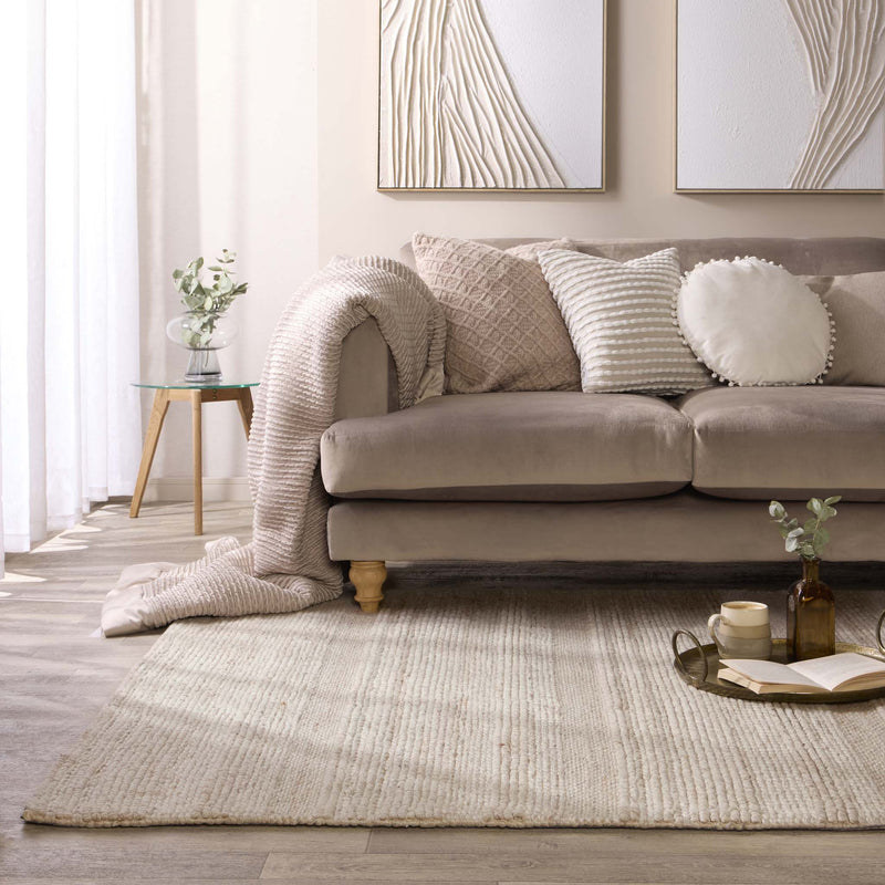 Chunky Knit Cream Wool Rug with a knitted pattern design, styled in a living room.