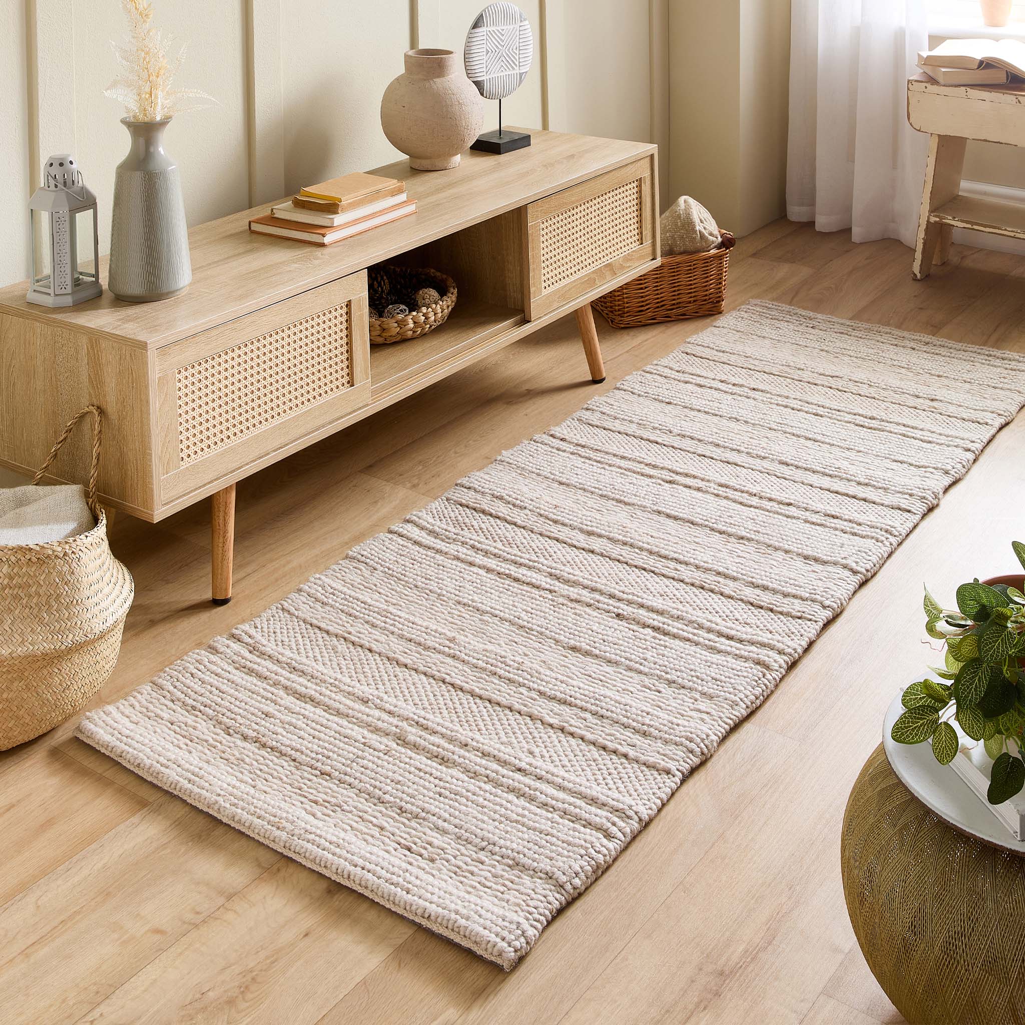 Chunky Knit Cream Wool Runner with a knitted pattern design, styled on wooden flooring.