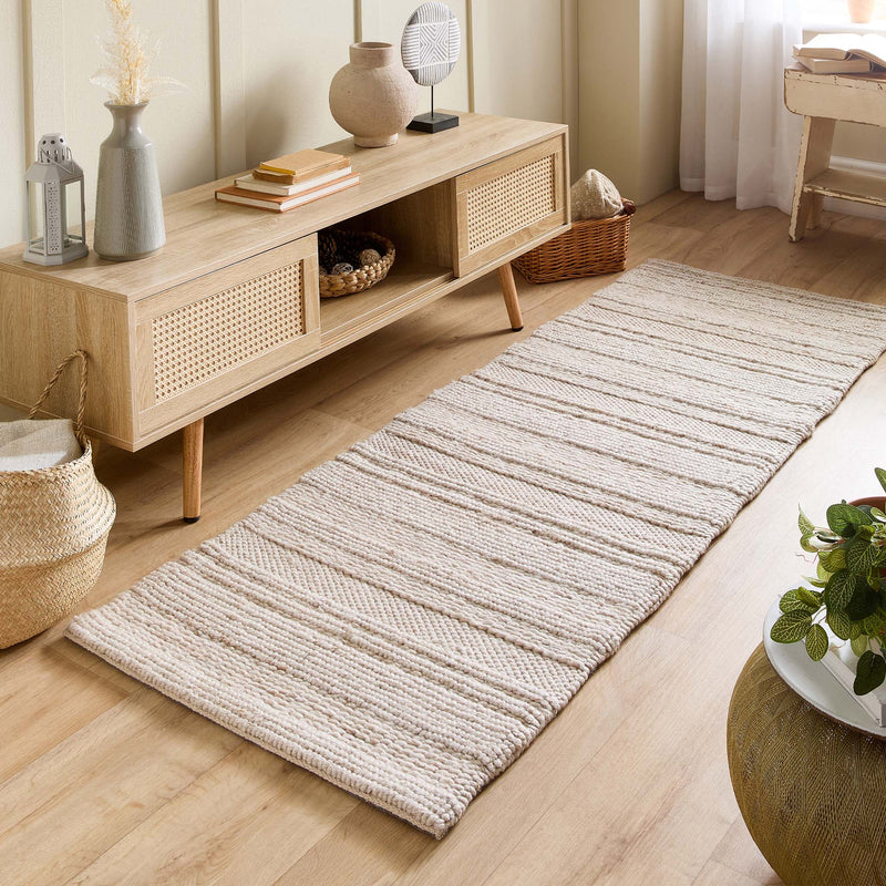 Chunky Knit Cream Wool Runner with a knitted pattern design, styled on wooden flooring.