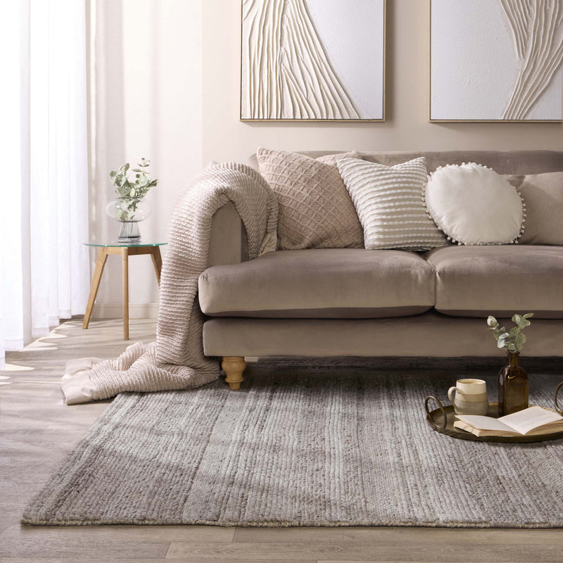 Chunky Knit Grey Wool Rug with a knitted pattern design, styled in a living room.