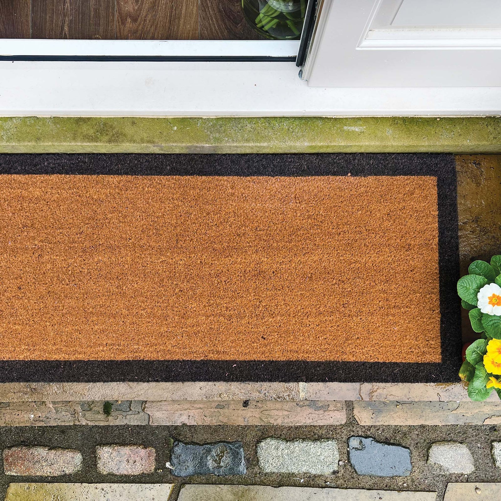 Printed Coir Border Black Runner. Made from eco-friendly materials featuring a black border. 