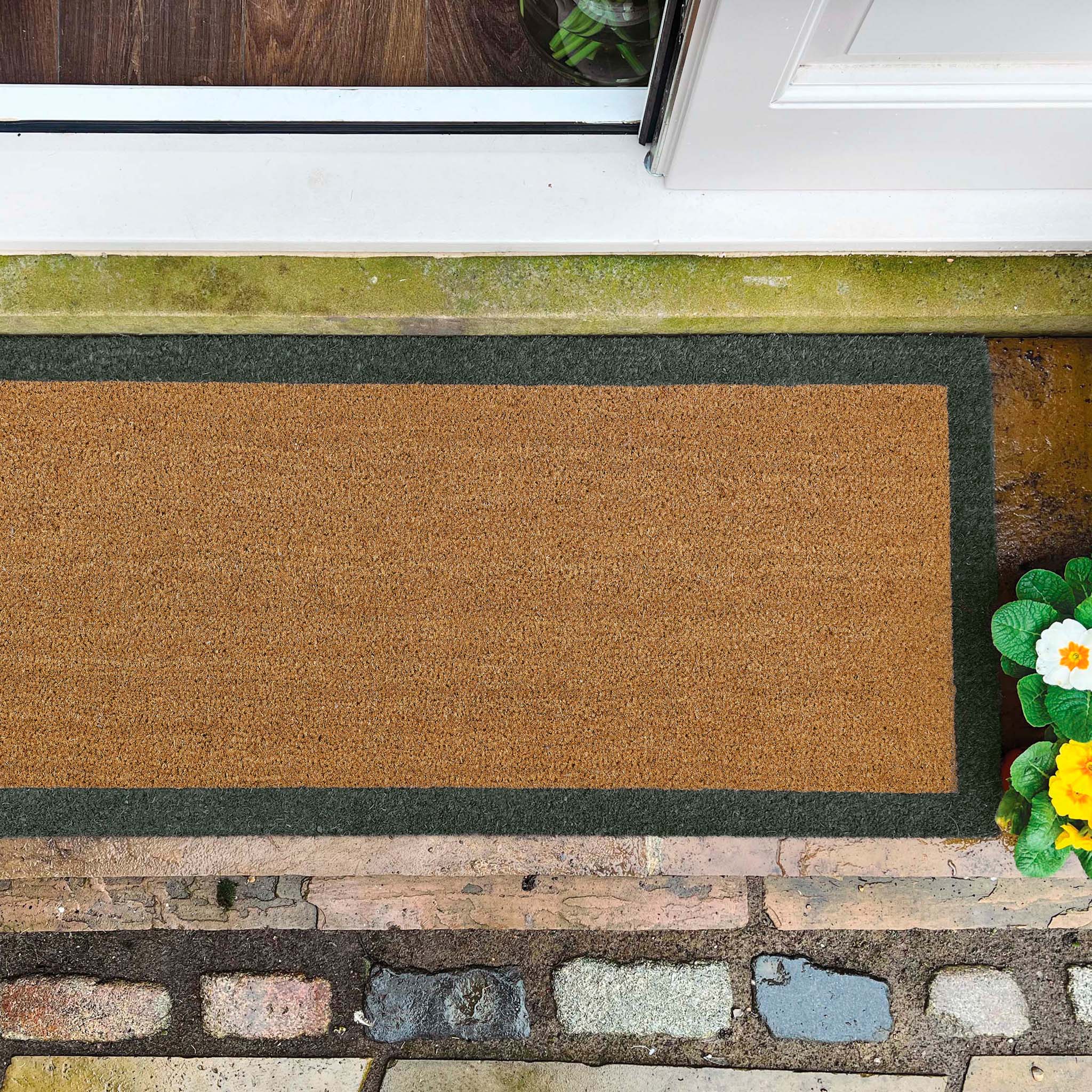 Printed Coir Border Green Runner- made from recycled materials featuring a green border.