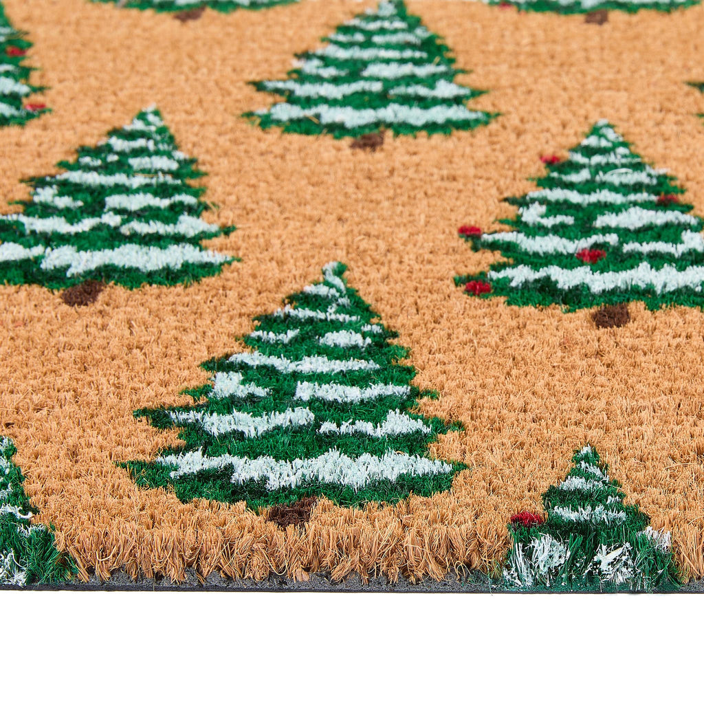 Close-up of Christmas Trees Coir Doormat showing the pile height and the snow dusted Christmas tree design.