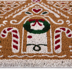 Close-up of Gingerbread Cottage Coir showing a fun Christmas gingerbread house design.