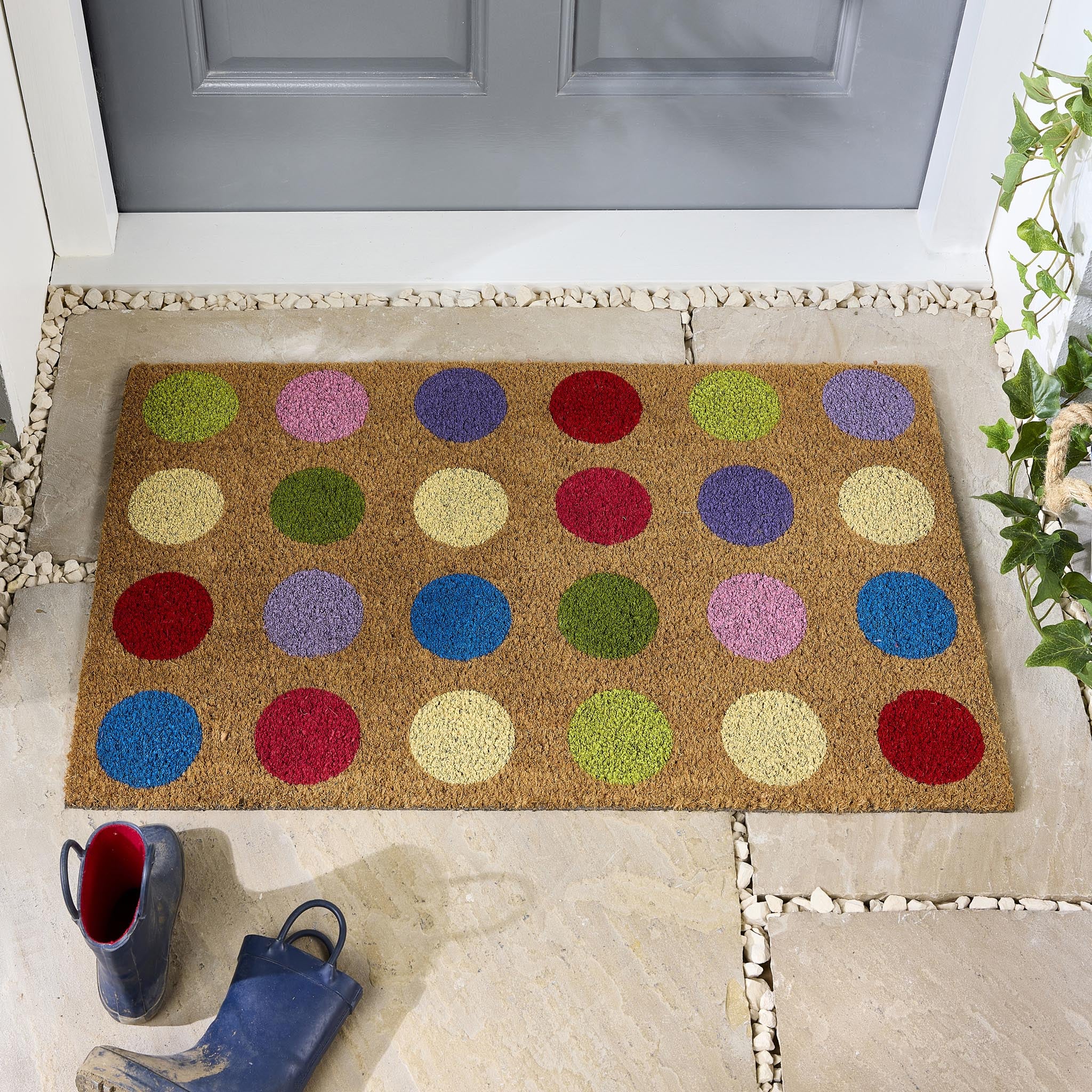 Spots Coir Doormat made from natural coconut husk fibres, featuring a multi coloured spot design.