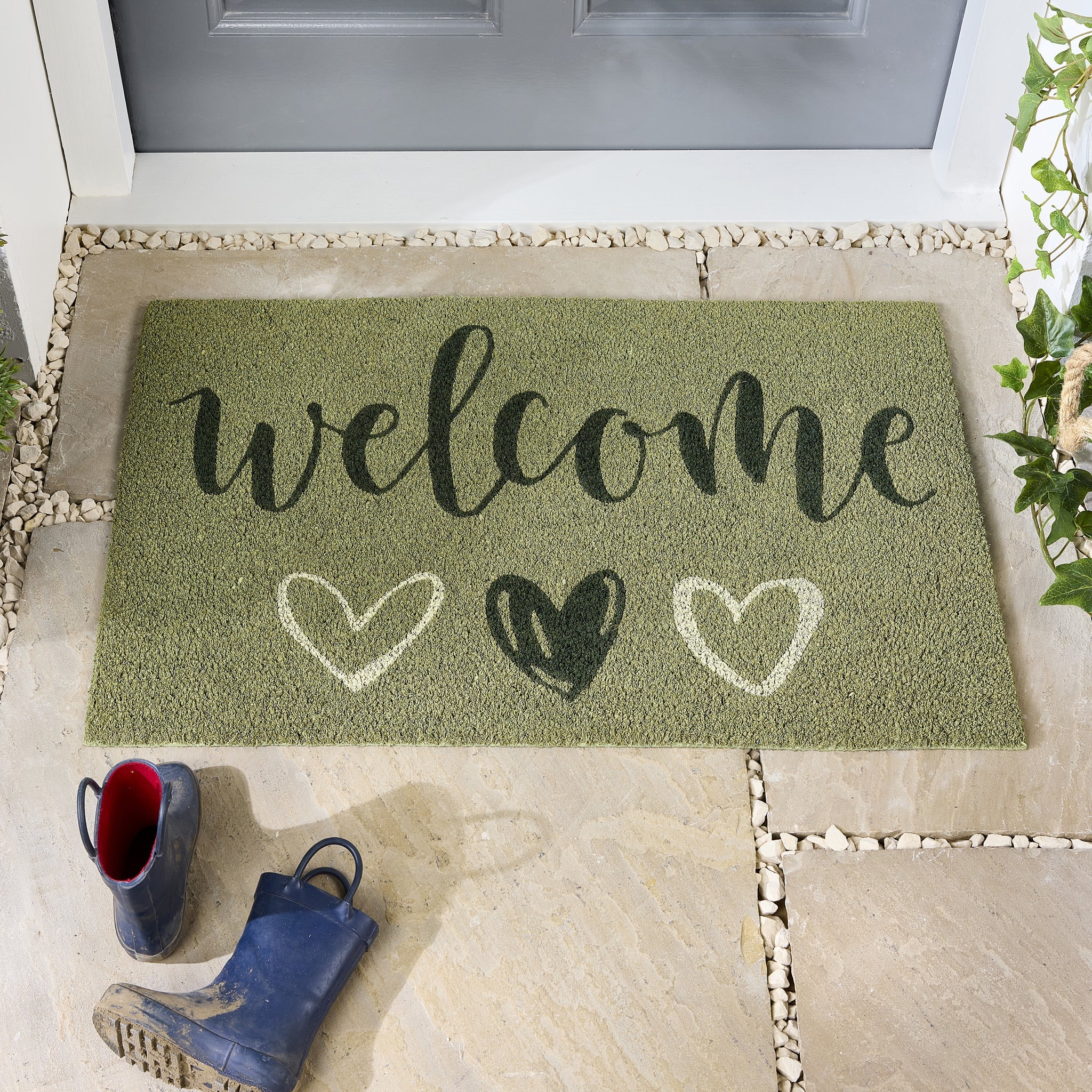 Welcome Sage Coir Doormat made from natural coconut fibres, featuring the word ‘welcome’ written in dark green font.