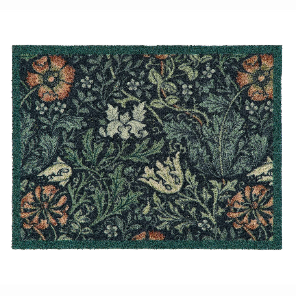 A rectangular outdoor doormat with a dark green border and a dense floral and botanical pattern in muted green, beige, orange, and white on a dark background.