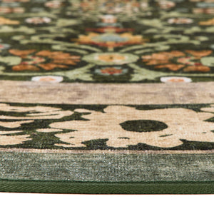 Close-up of Country Paisley Green Eco-Washable Circle Rug with a floral design.