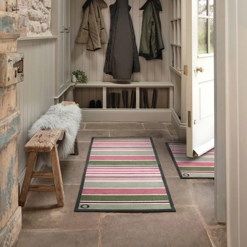 Country Rose Stripe Runner and Doormat with a pink and green stripe design, styled in a doorway.