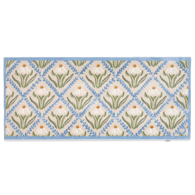 Daisy Trellis Washable Runner- a 100% recycled cotton runner featuring a daisy motif arranged within a trellis of blue, vine-like lines.