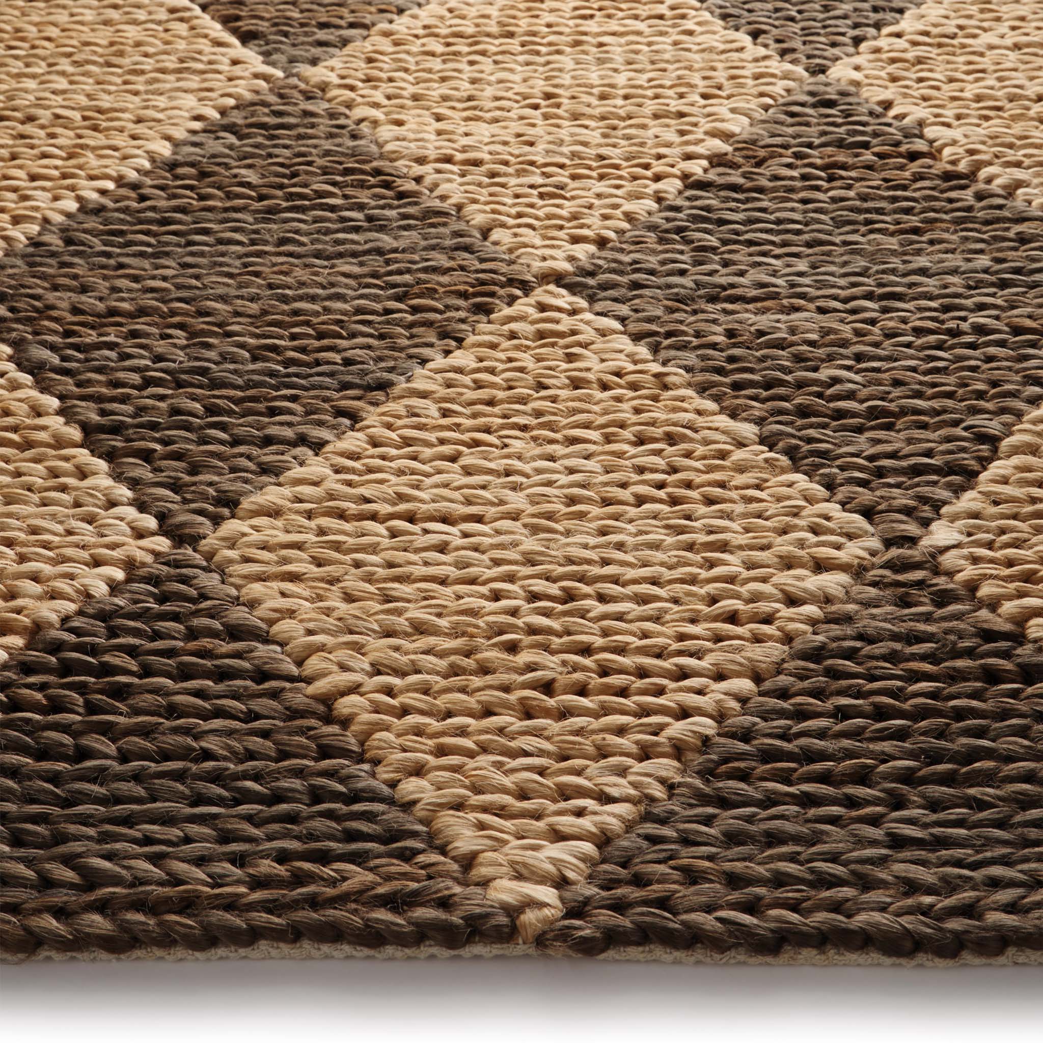 Close-up of Diamond Jute Natural/Brown Rug with a natural and brown diamond pattern.