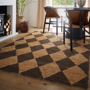 Diamond Jute Natural/Brown Rug with a natural and brown diamond pattern., styled in a dining room.